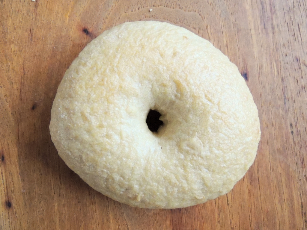 Round sourdough bagel sitting on a table