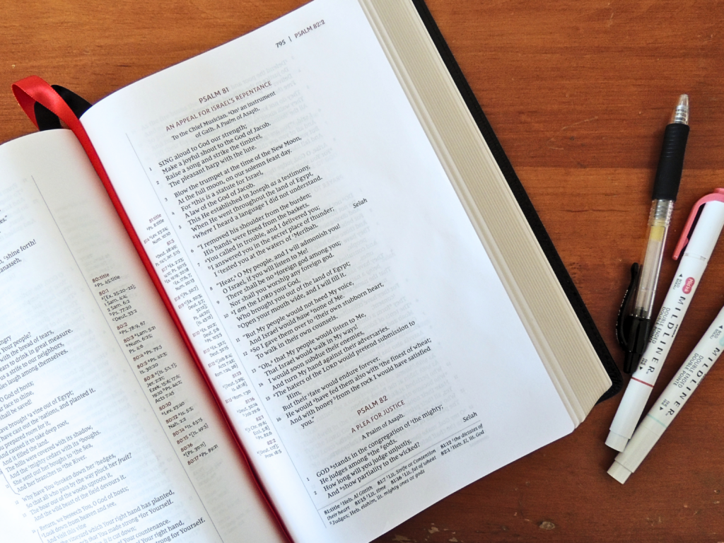 Bible opened in the morning to Psalm 81, with a pen and markers