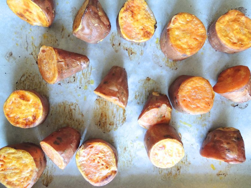 potatoes on a baking sheet lined with parchment paper, flipped