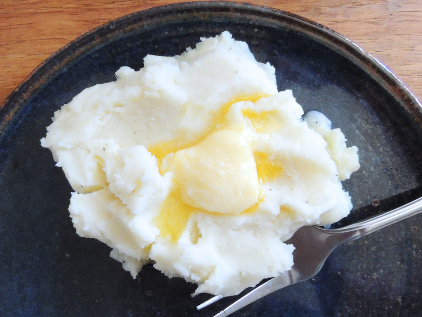 one serving of mashed potatoes with melted butter