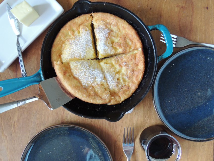 Breakfast table with dutch baby and plates